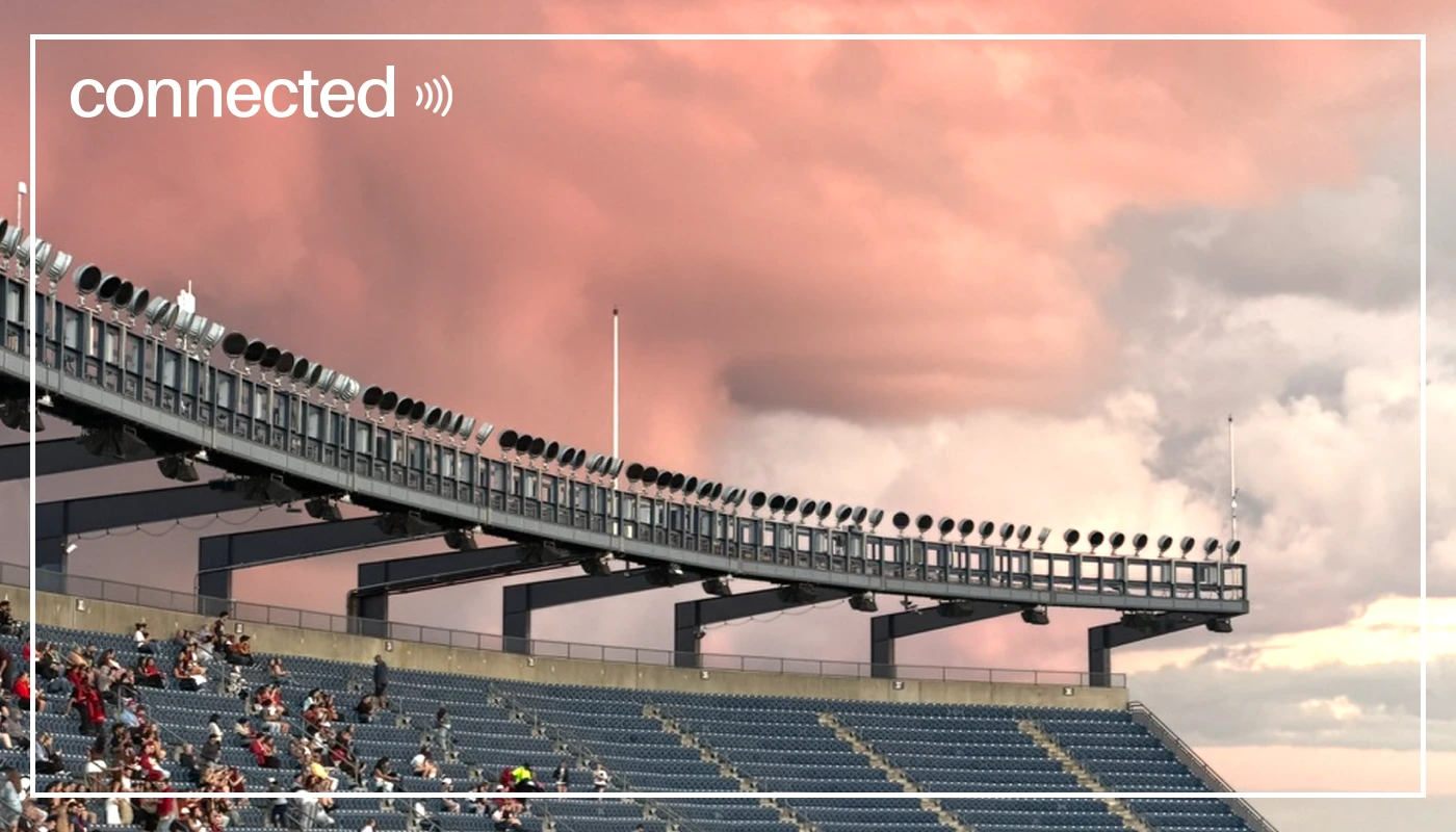 Reverse of the card: a stadium under a pink sky, with the word connected.